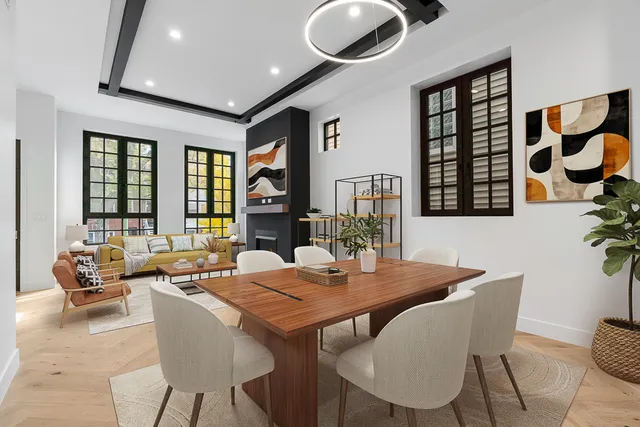 a view of a dining room with furniture and window