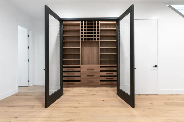 a view of walk in closet with empty racks