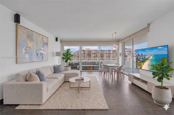 a living room with furniture and a large window