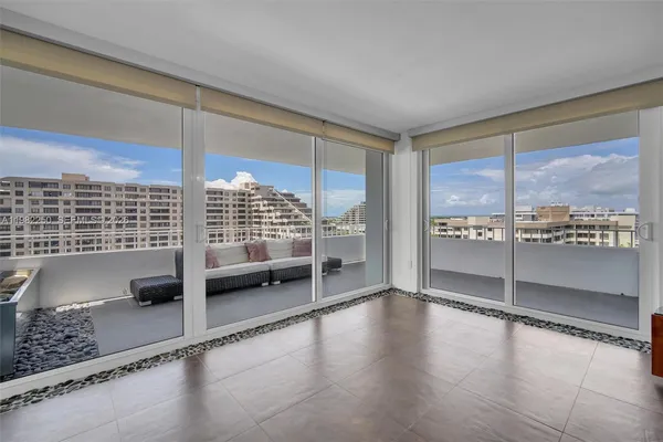a view of a floor to ceiling window and a kitchen