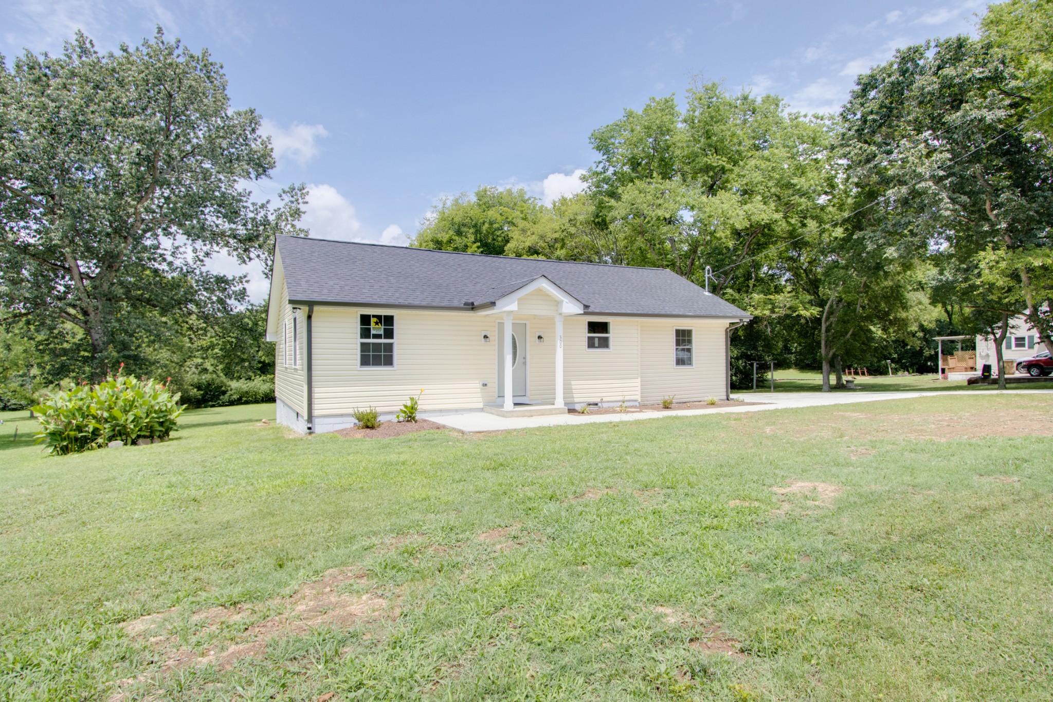 300 Randy Road Madison, TN 37115 - Photo 2 of 36 a view of a house with backyard and trees