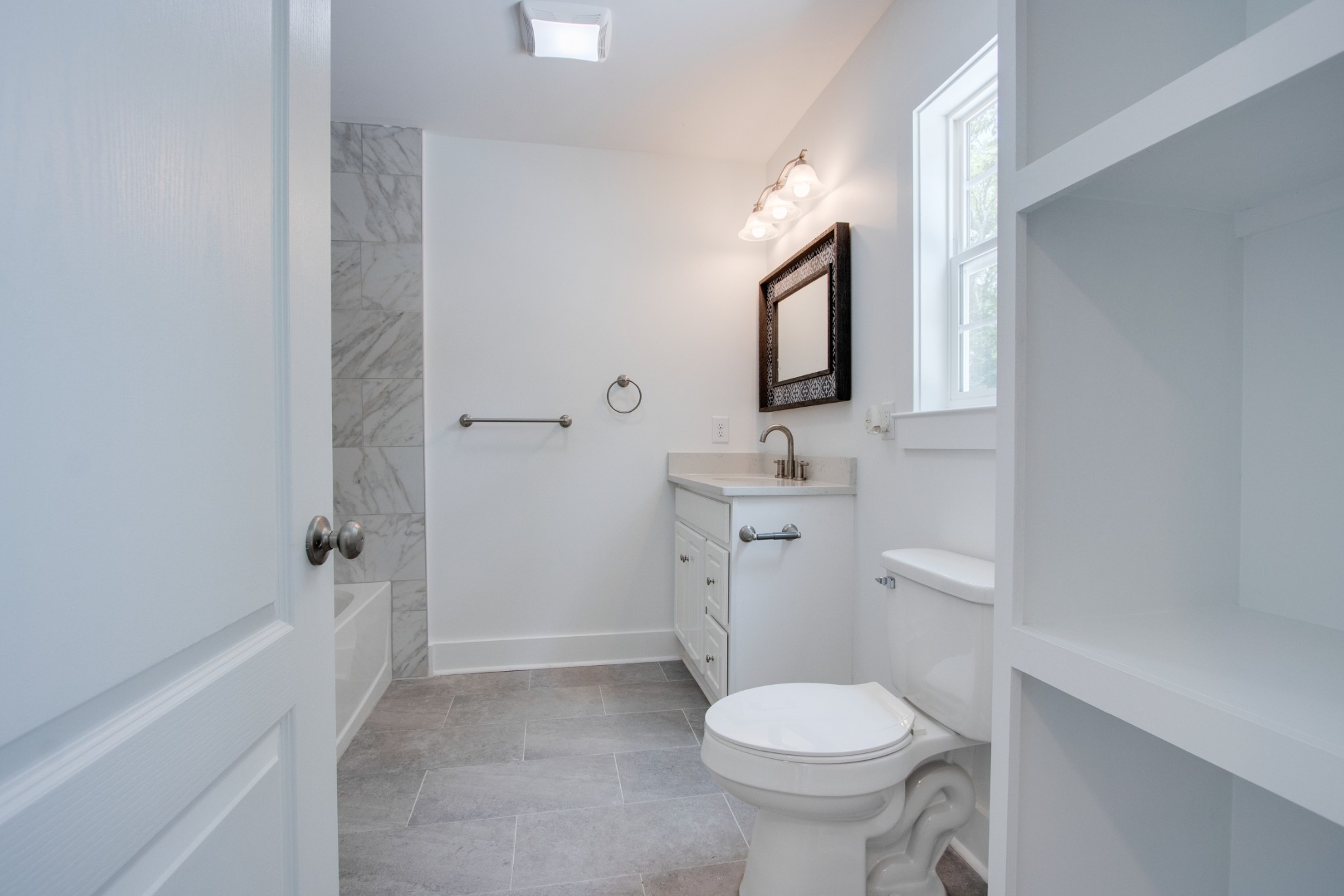 300 Randy Road Madison, TN 37115 - Photo 18 of 36 a bathroom with a toilet sink and mirror