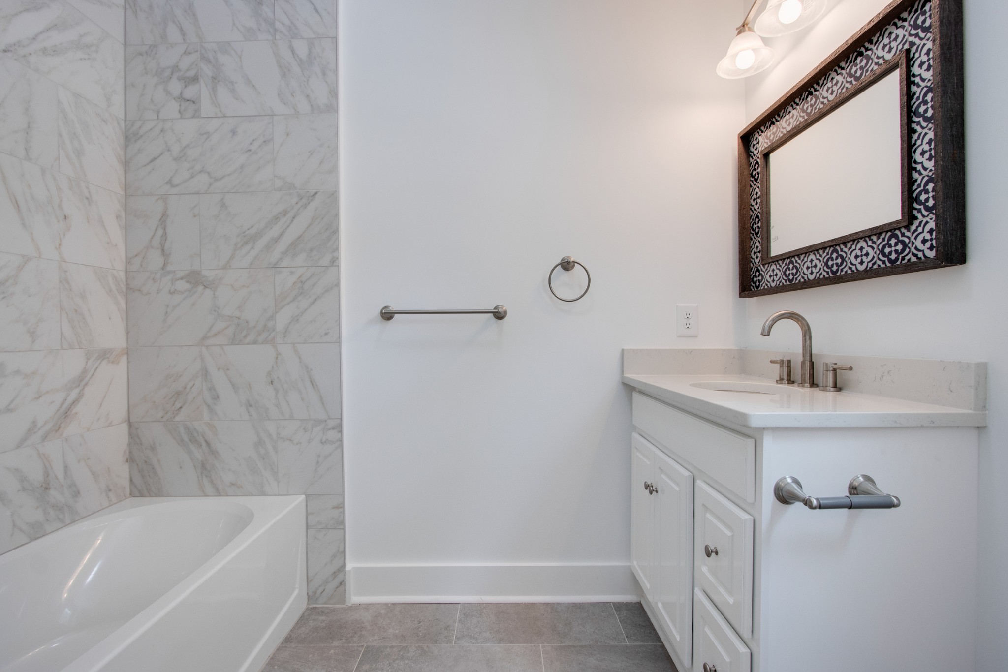 300 Randy Road Madison, TN 37115 - Photo 19 of 36 a bathroom with a tub a sink and mirror