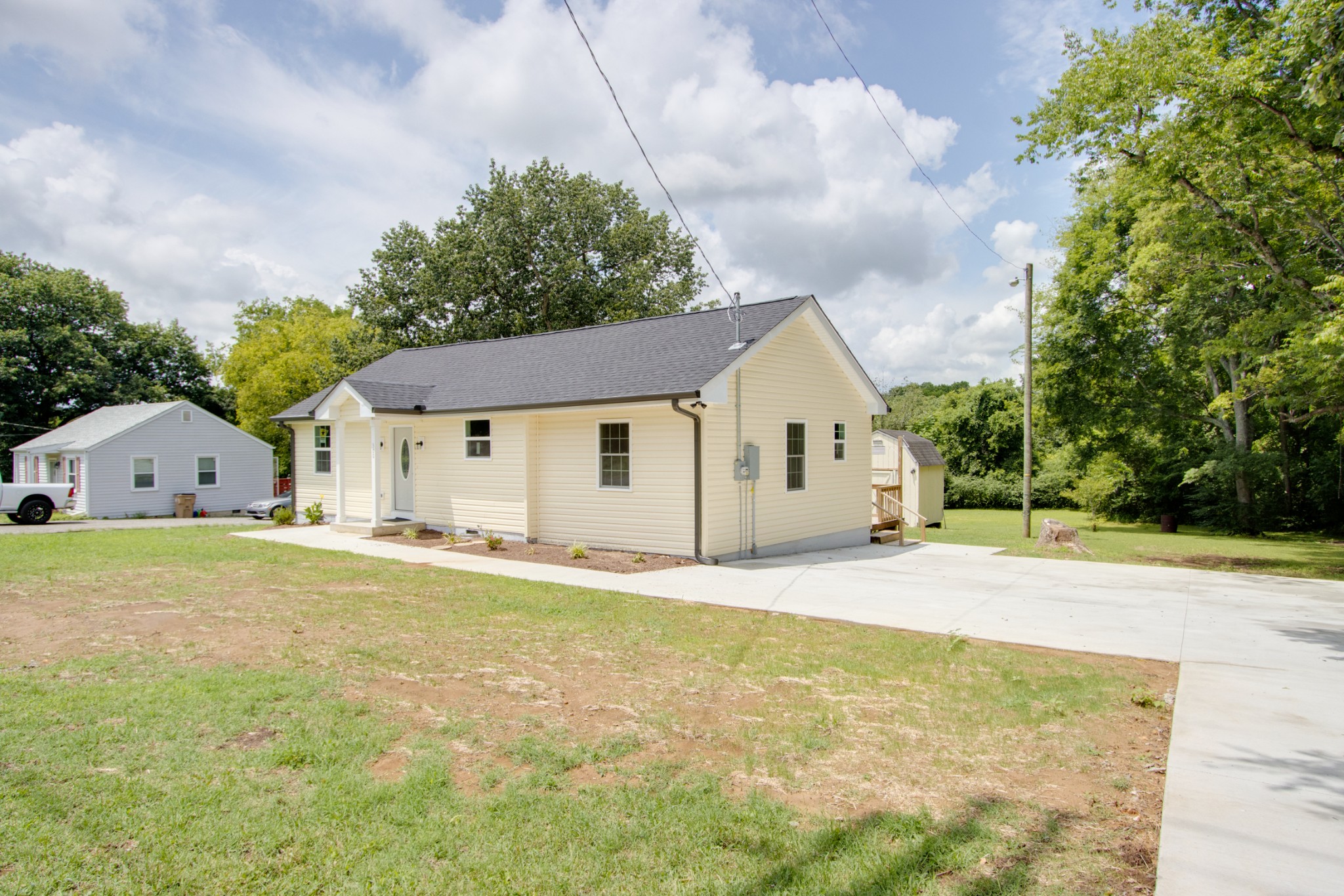 300 Randy Road Madison, TN 37115 - Photo 3 of 36 a front view of house with yard and trees in the background