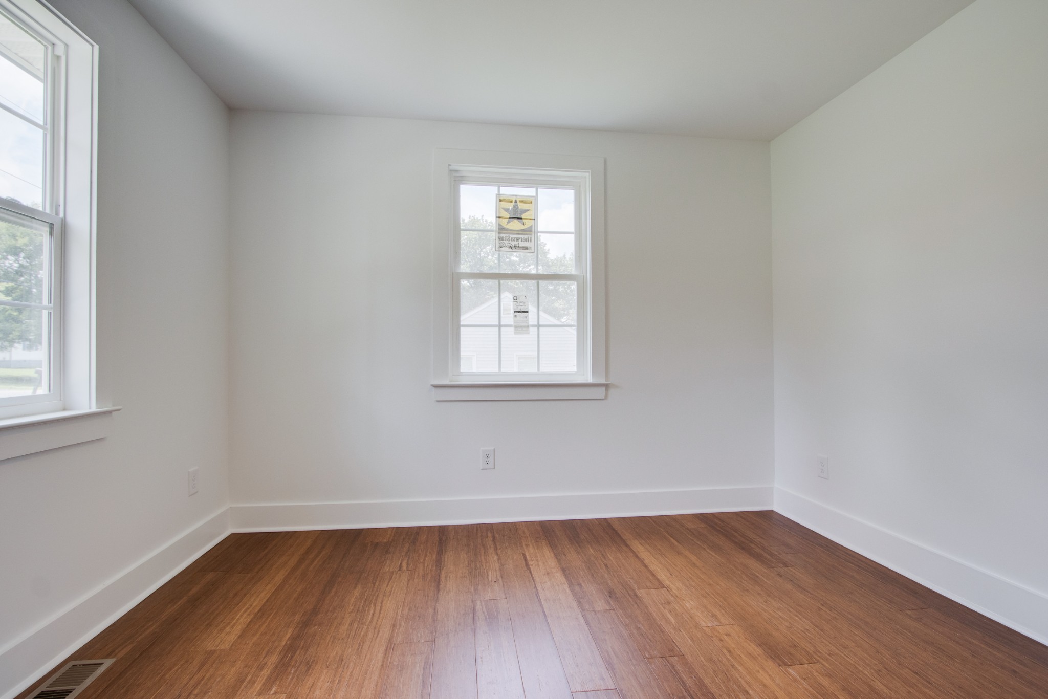 300 Randy Road Madison, TN 37115 - Photo 22 of 36 an empty room with wooden floor and windows