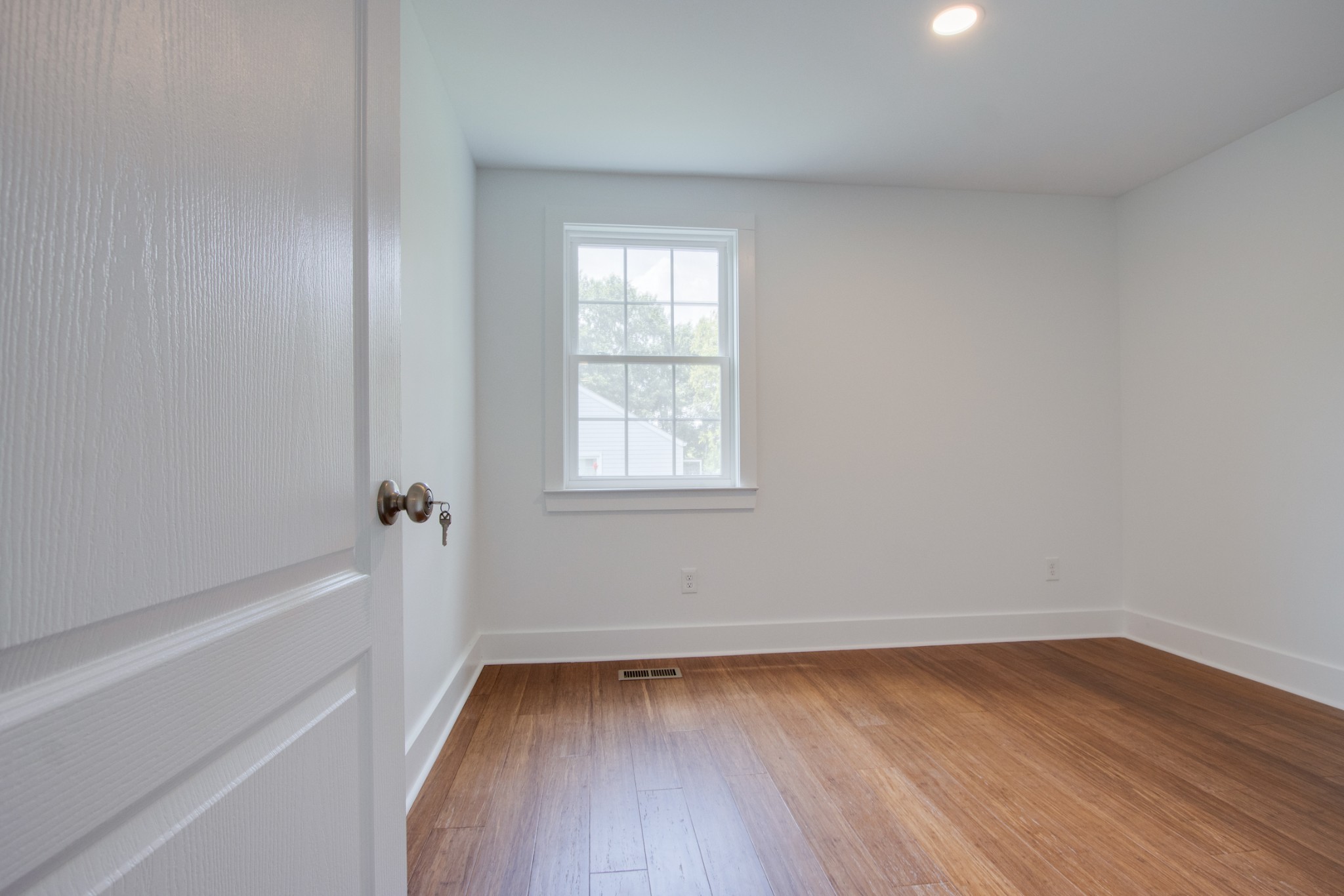 300 Randy Road Madison, TN 37115 - Photo 27 of 36 a view of an empty room with wooden floor and a window