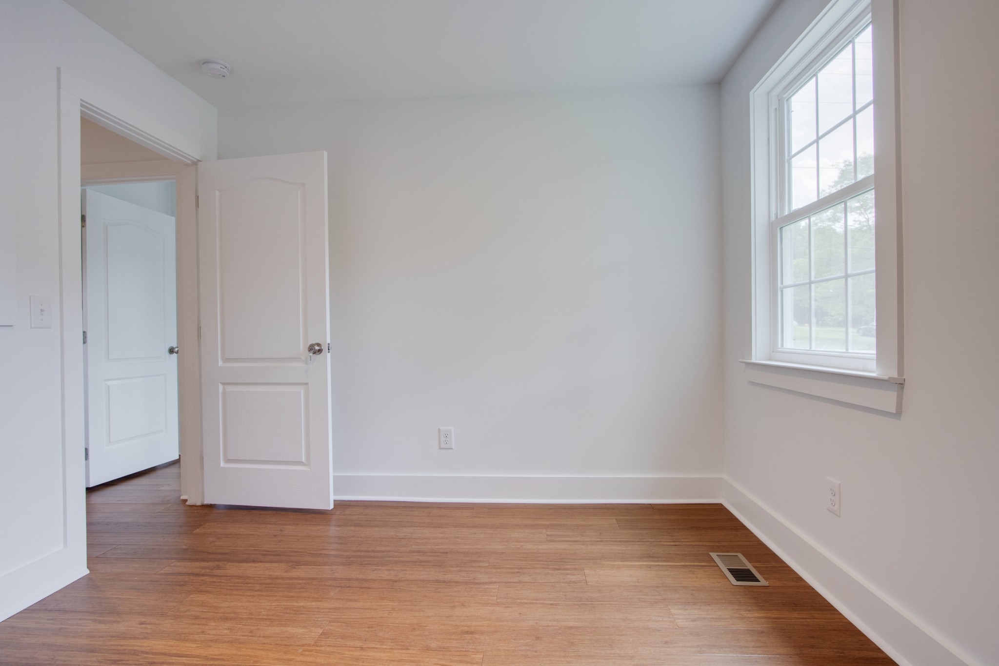 300 Randy Road Madison, TN 37115 - Photo 28 of 36 an empty room with wooden floor and window