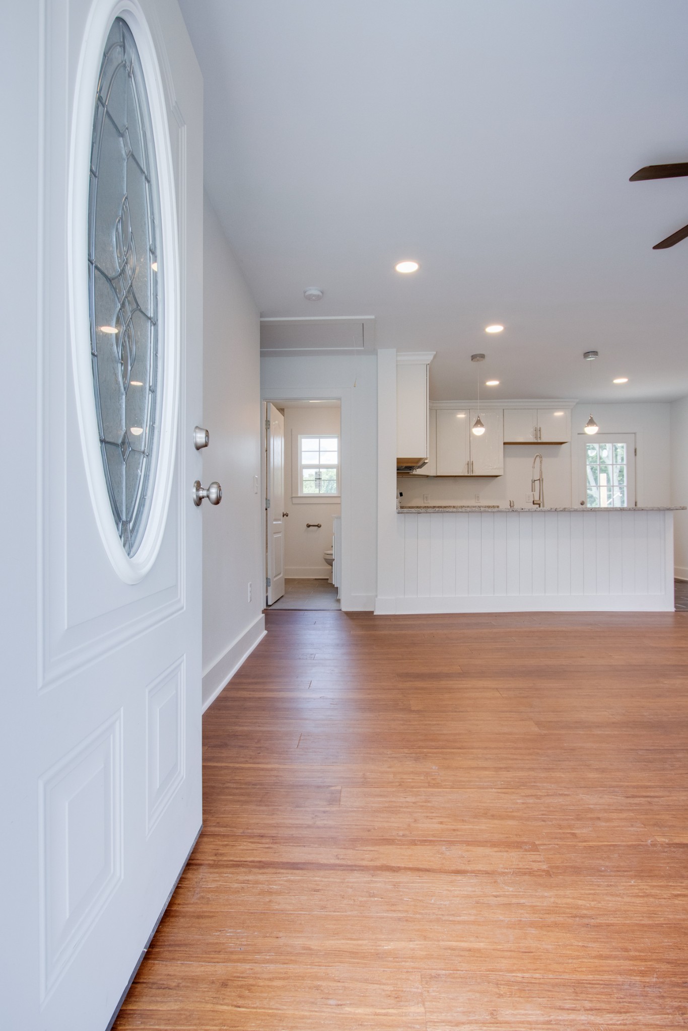 300 Randy Road Madison, TN 37115 - Photo 4 of 36 an empty room with wooden floor mirror and windows