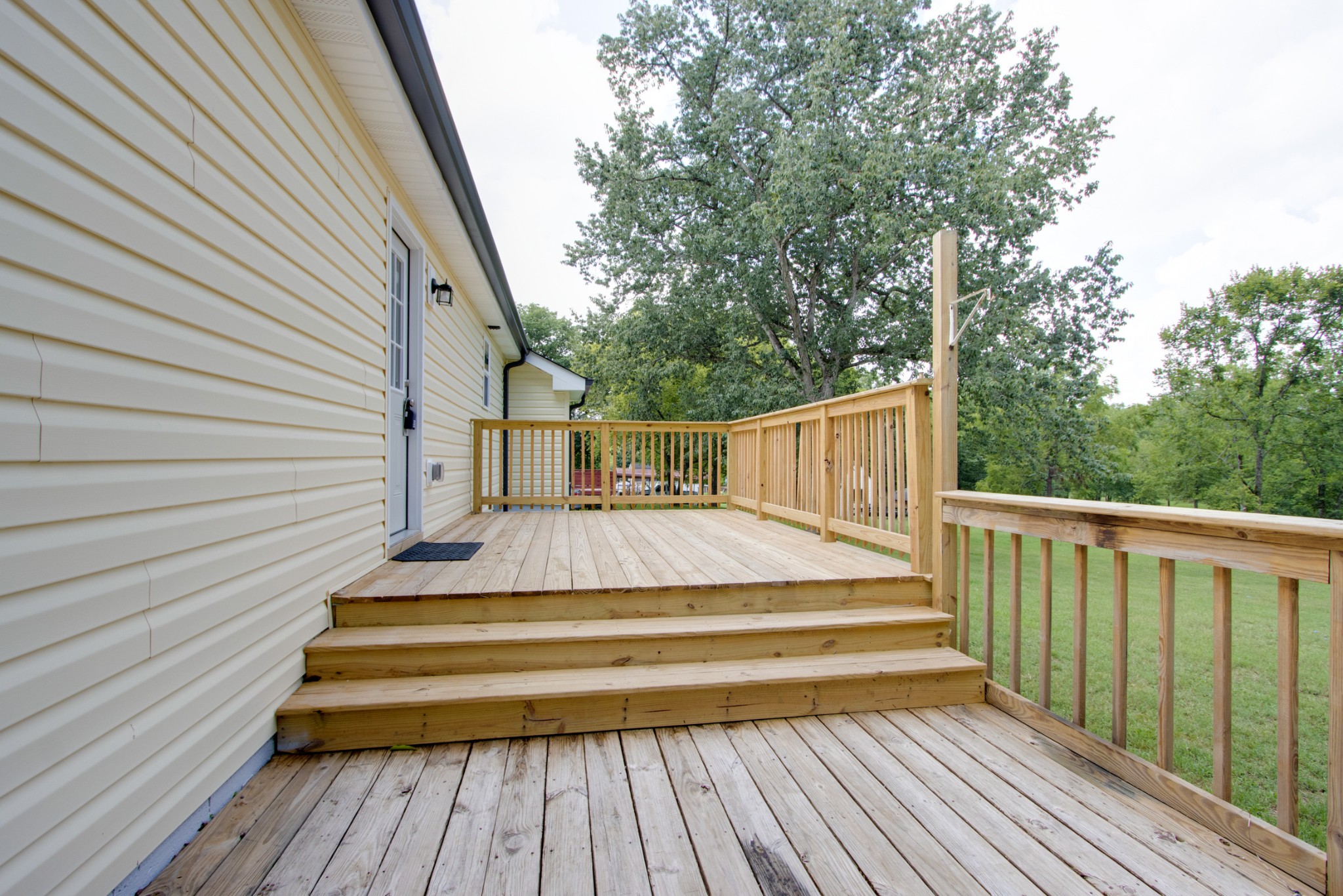 300 Randy Road Madison, TN 37115 - Photo 32 of 36 a view of backyard with wooden deck and trees