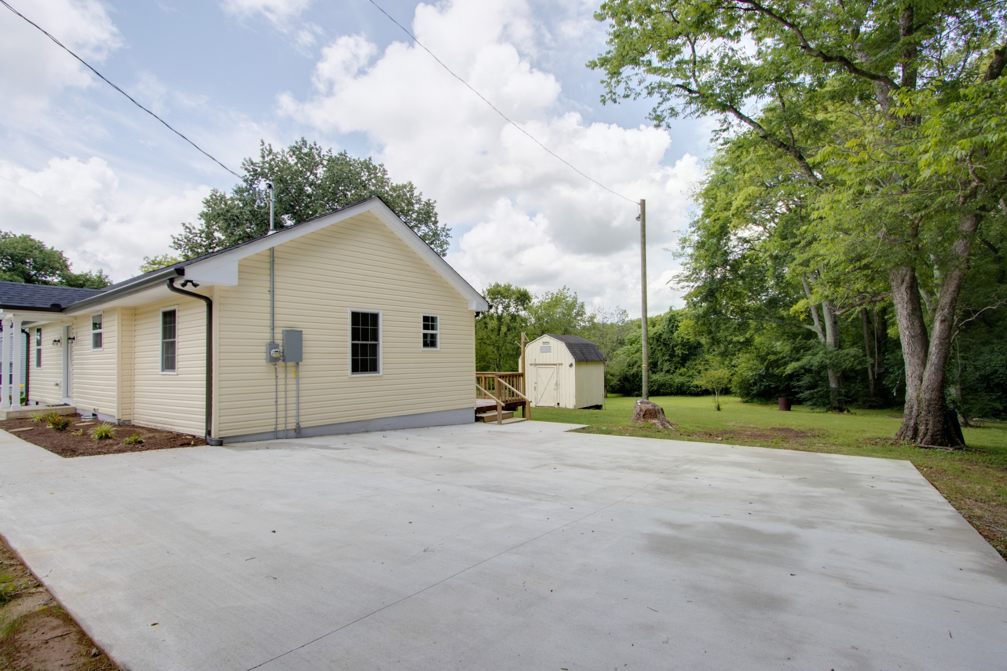 300 Randy Road Madison, TN 37115 - Photo 33 of 36 a view of a house with backyard and trees