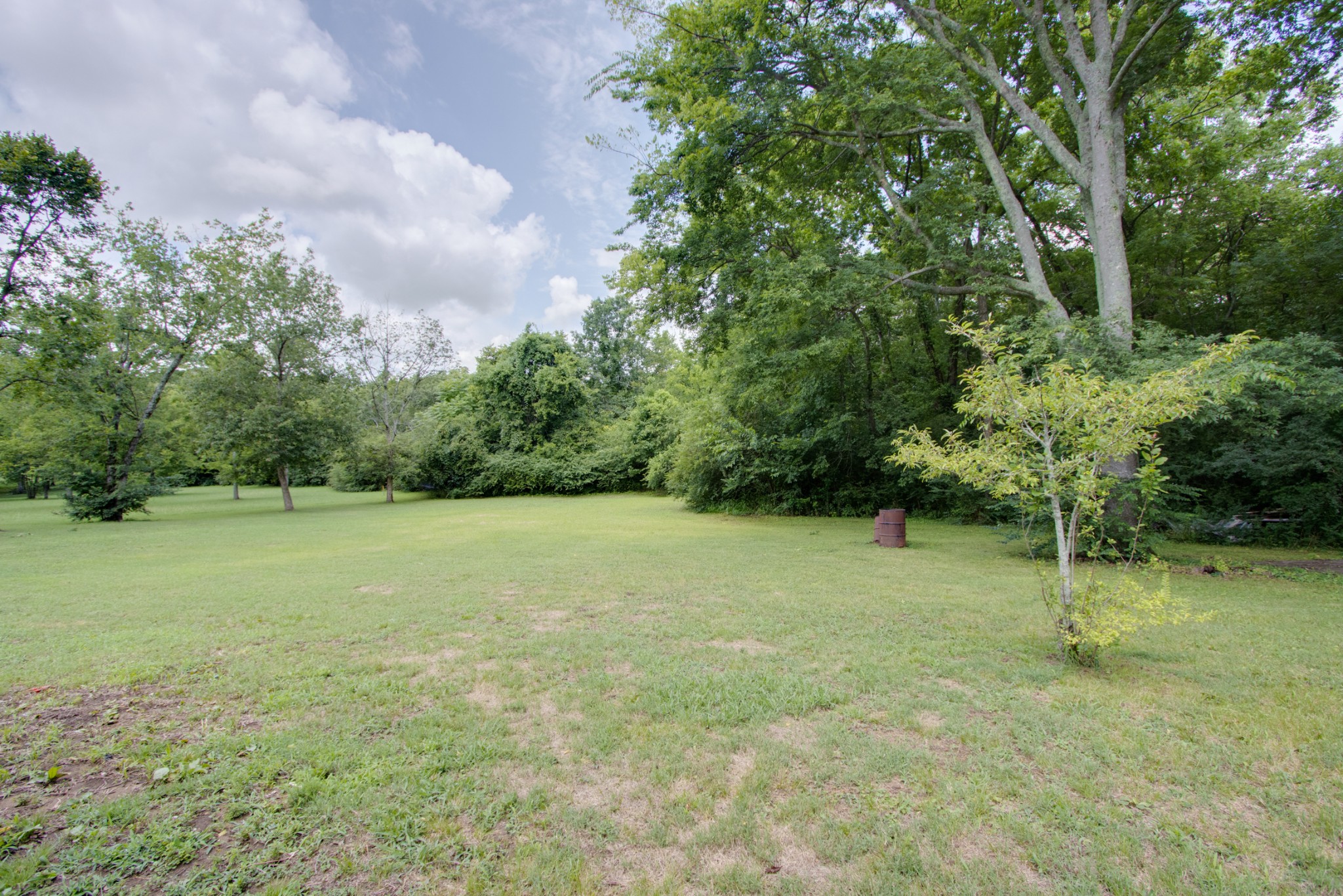 300 Randy Road Madison, TN 37115 - Photo 35 of 36 a view of a field with trees in the background