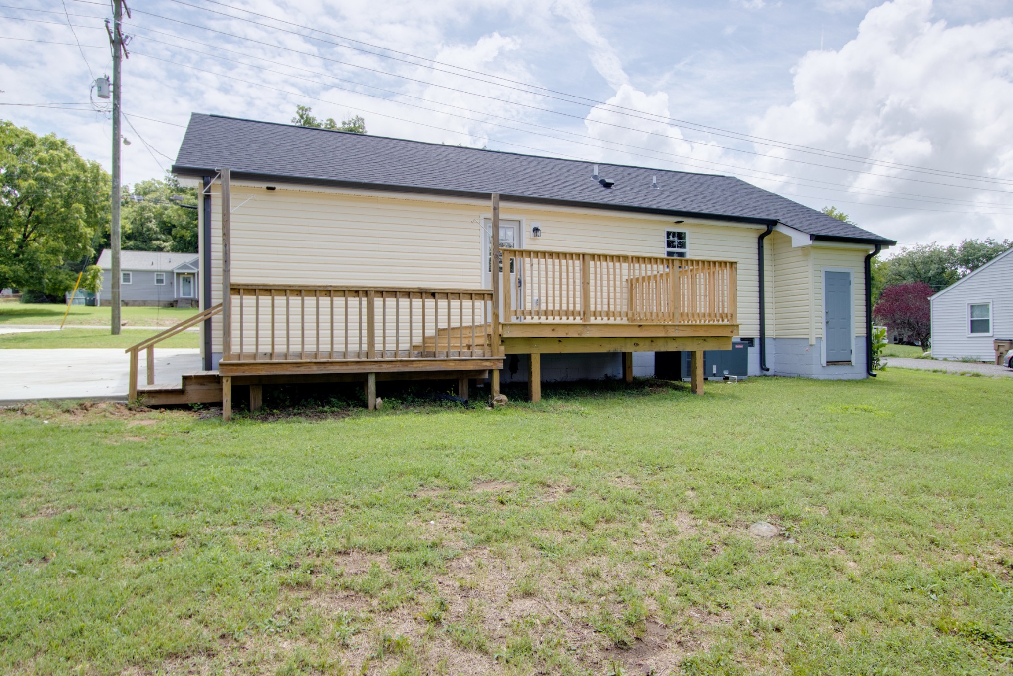 300 Randy Road Madison, TN 37115 - Photo 36 of 36 a backyard of a house with a garden and deck