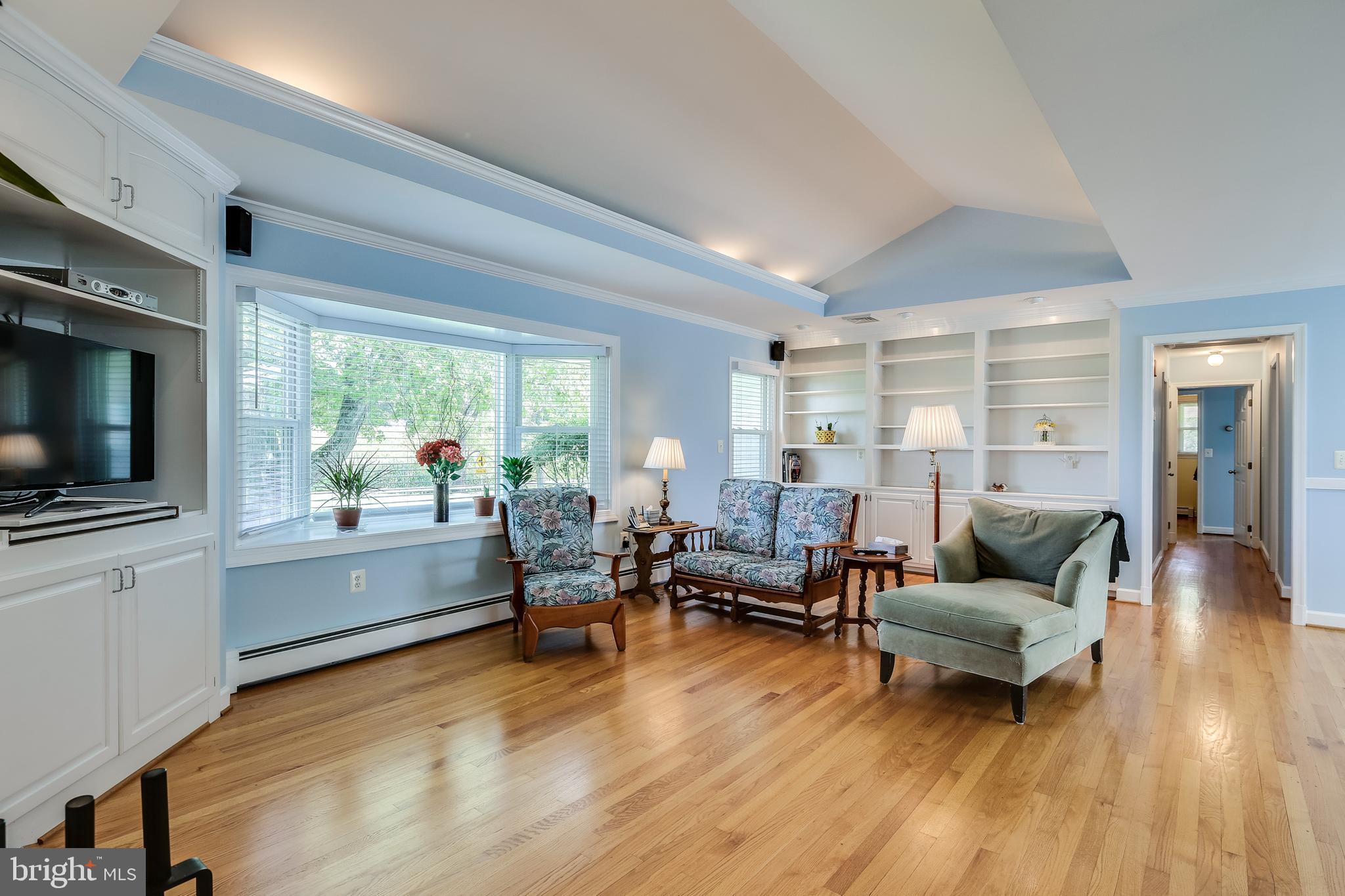 22720 Woodfield Road Gaithersburg, MD 20882 - Photo 15 of 39 Custom built-in shelving and gorgeous bay window.