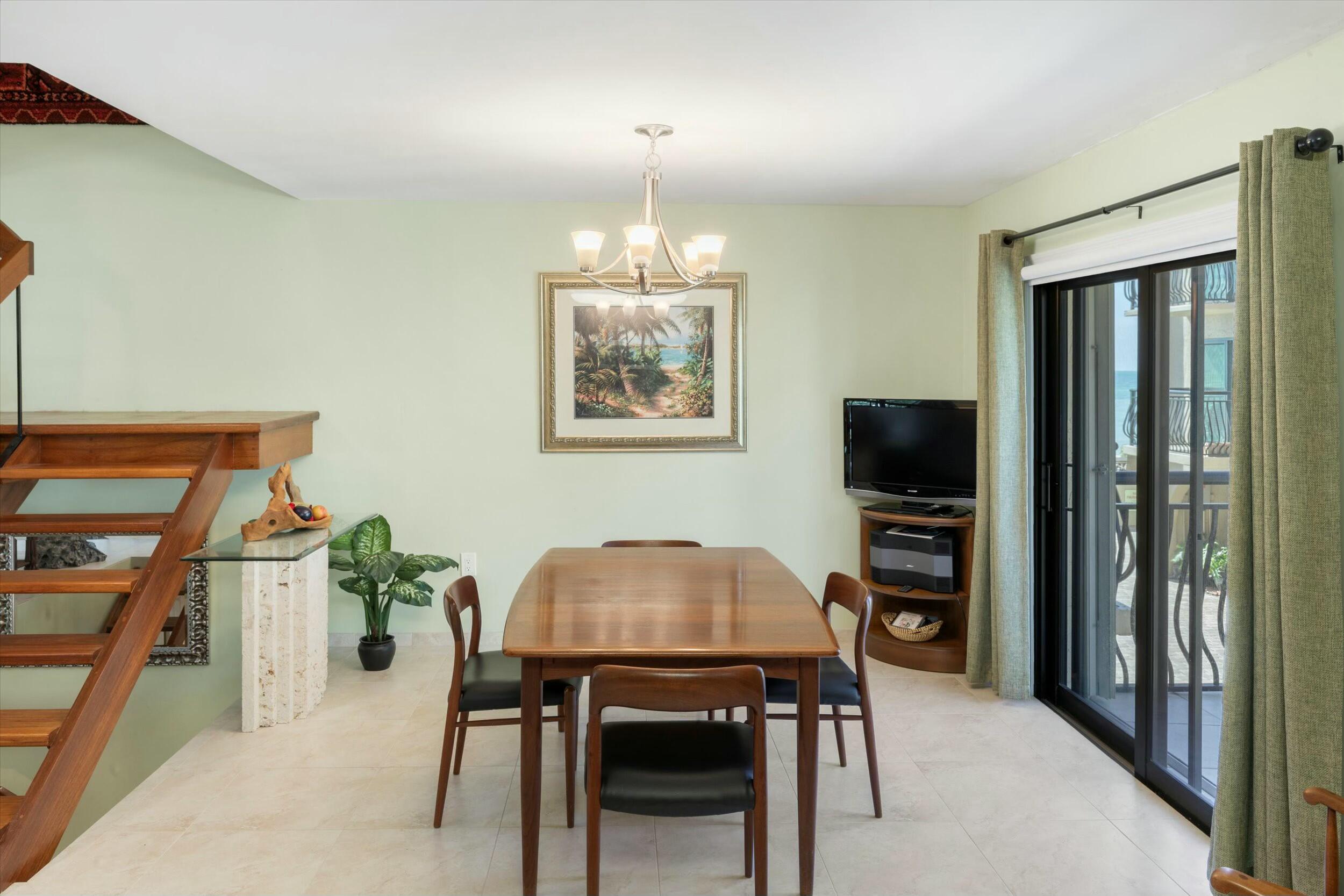 1616 Atlantic Boulevard, Unit 13 Key West, FL 33040 - Photo 12 of 38 a view of a livingroom with furniture and window