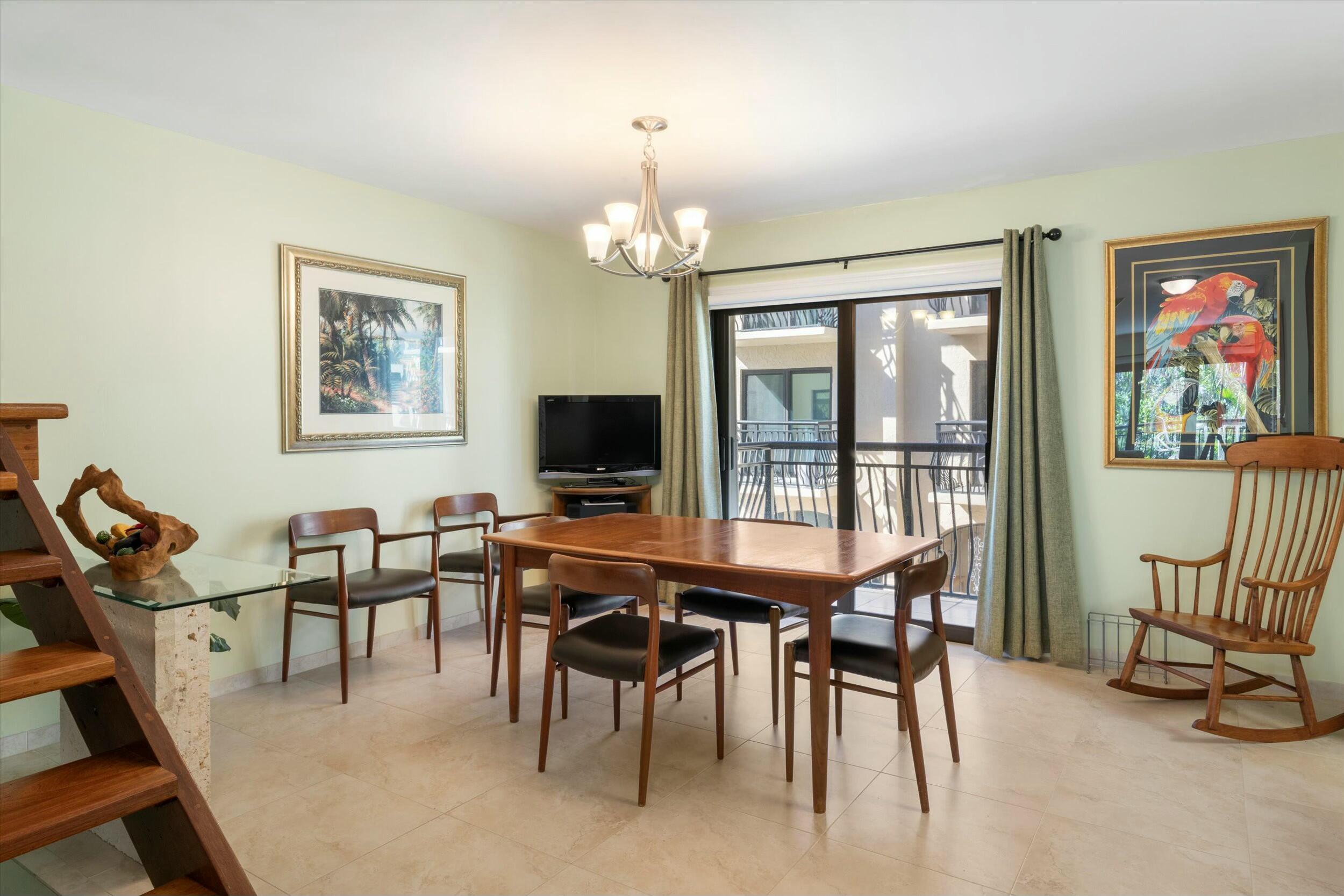 1616 Atlantic Boulevard, Unit 13 Key West, FL 33040 - Photo 27 of 38 a view of a dining room with furniture window and outside view