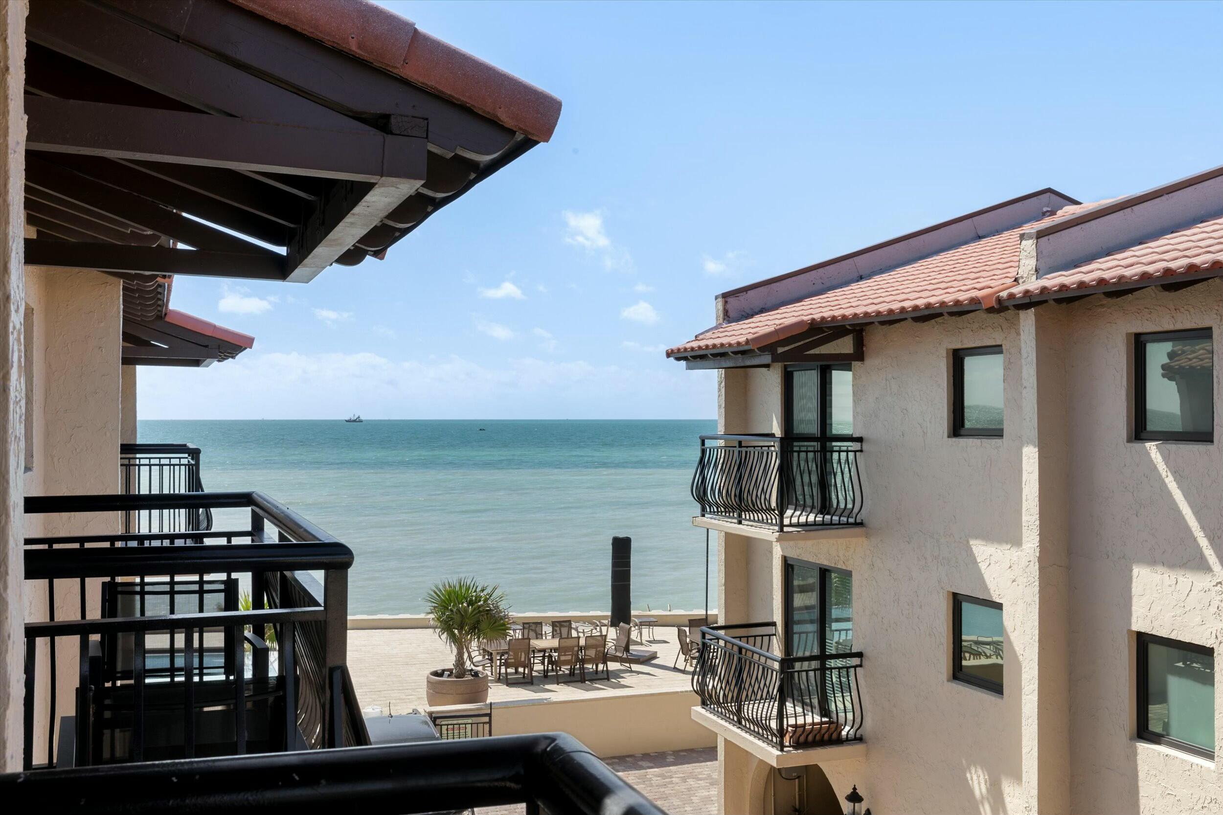 1616 Atlantic Boulevard, Unit 13 Key West, FL 33040 - Photo 34 of 38 a view of a balcony with chairs and potted plants