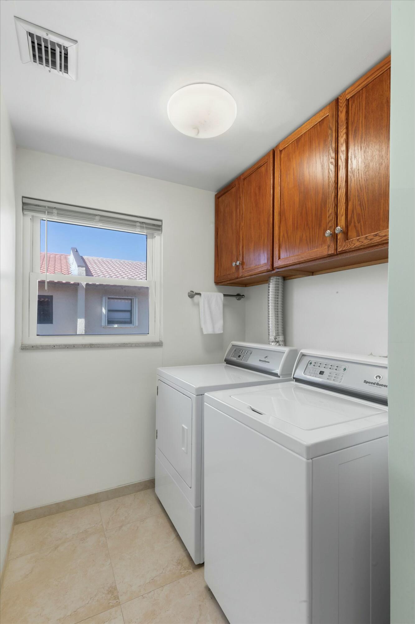 1616 Atlantic Boulevard, Unit 13 Key West, FL 33040 - Photo 35 of 38 a utility room with dryer and washer