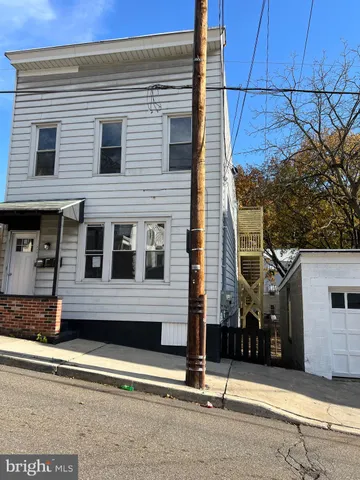 a view of a house with a street