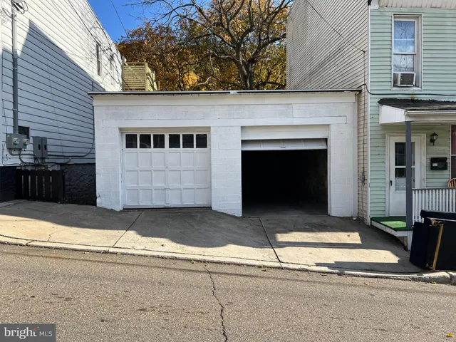 a front view of a house with a garage