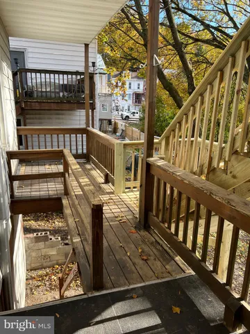 a view of a balcony with wooden floor