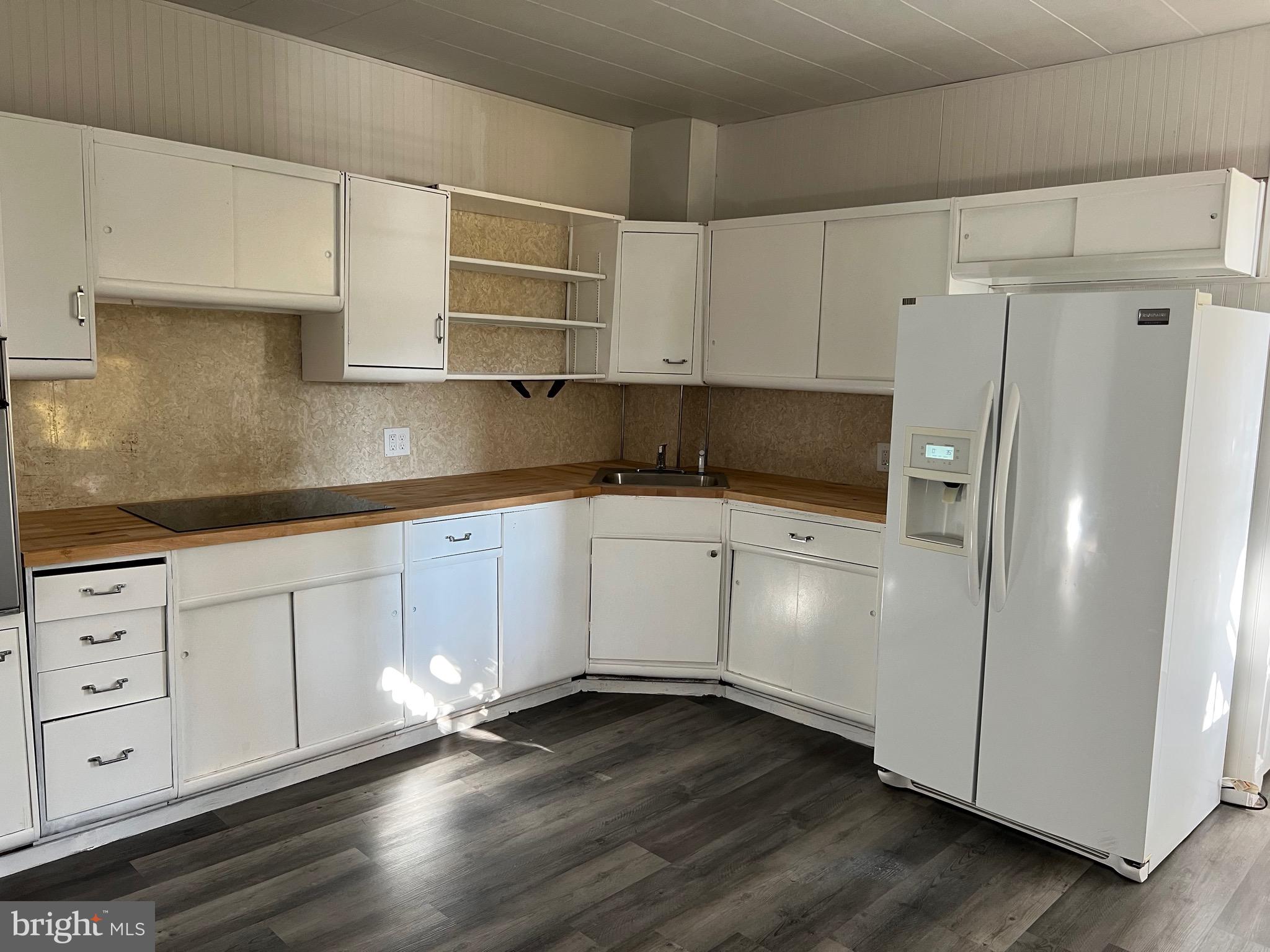 533 East Market Street Pottsville, PA 17901 - Photo 5 of 10 a kitchen with granite countertop white cabinets and white stainless steel appliances