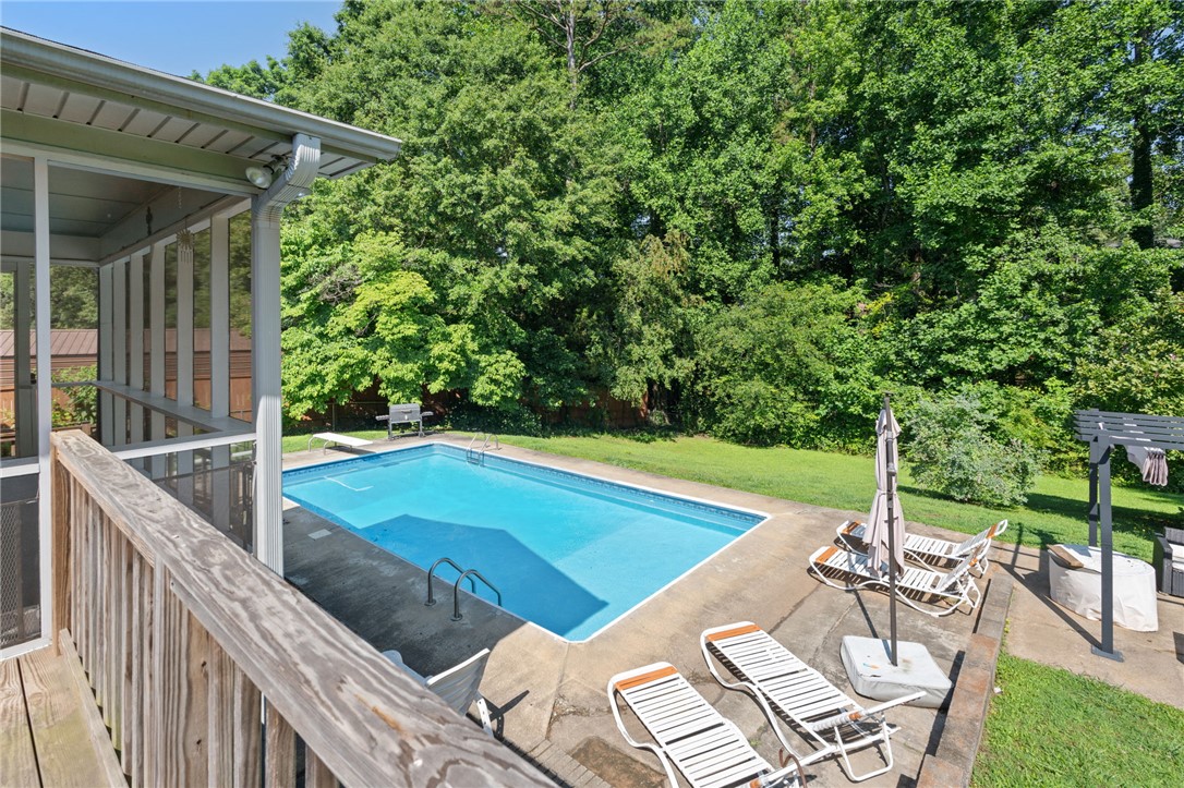 200 Echo Circle Easley, SC 29642 - Photo 24 of 35 A private swimming haven, bordered by a screened porch, offers tranquil outdoor living.