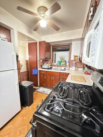a kitchen with a stove and a sink