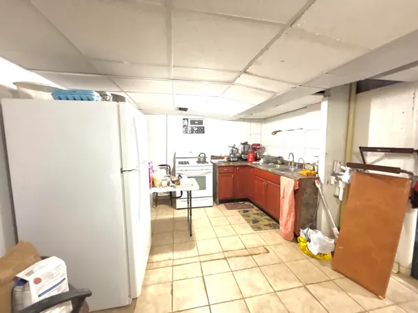 a kitchen with stainless steel appliances a refrigerator and a sink