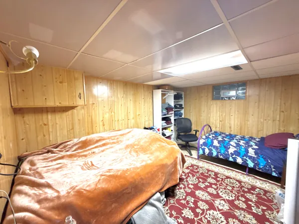 a bedroom with bed and window