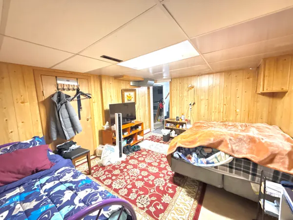 a bedroom with furniture and a window