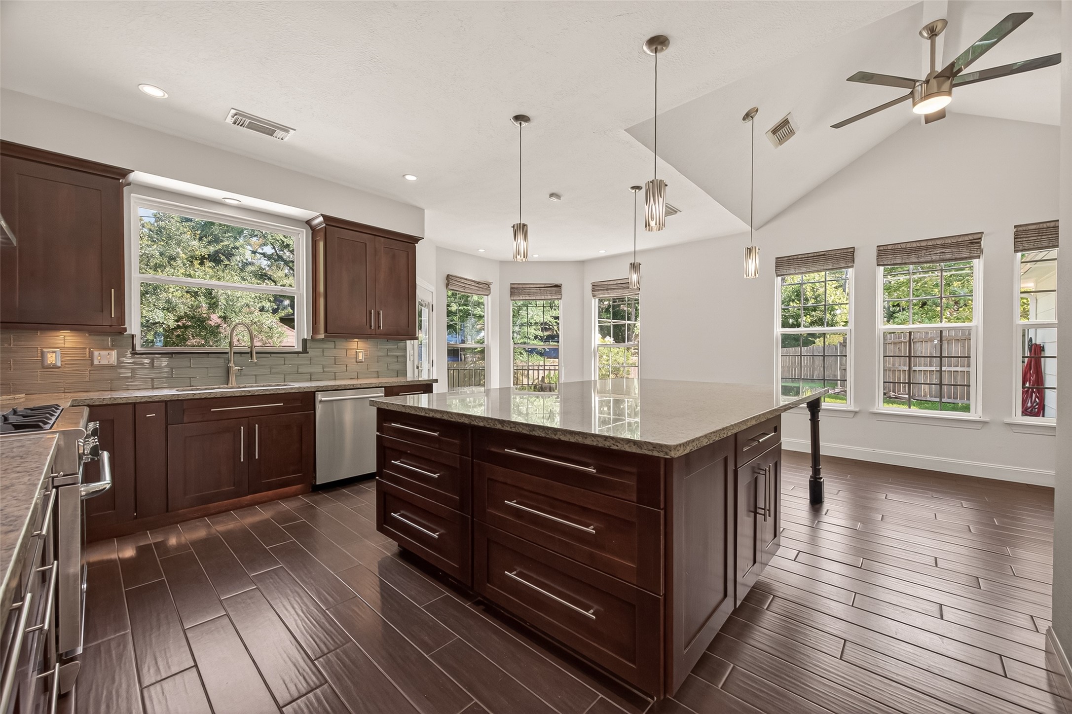 6131 Hampton Way Court Spring, TX 77389 - Photo 21 of 50 a kitchen with wooden floors and sink