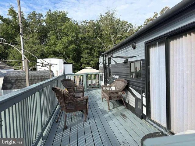a view of a balcony with chairs