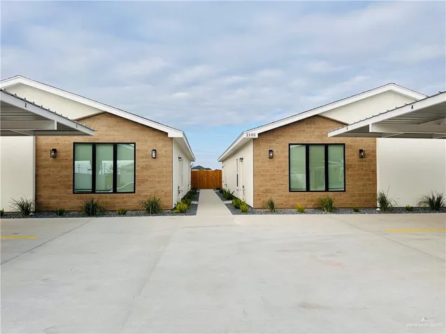 a view of a house with a snow in front of it