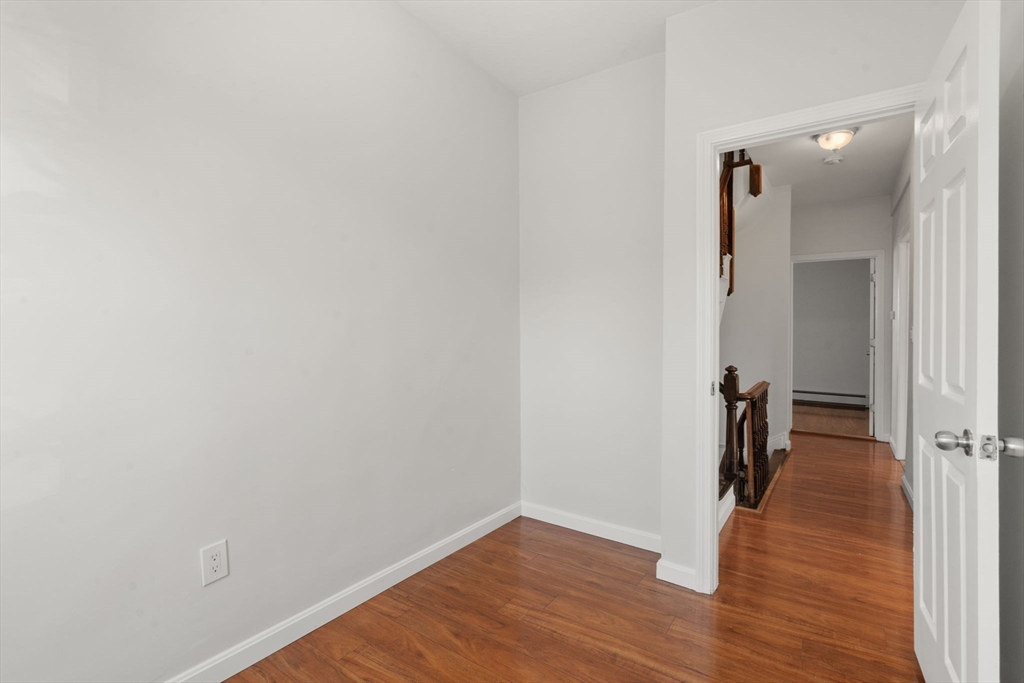 3 Atherton Street Boston, MA 02119 - Photo 19 of 29 a view of a hallway with wooden floor