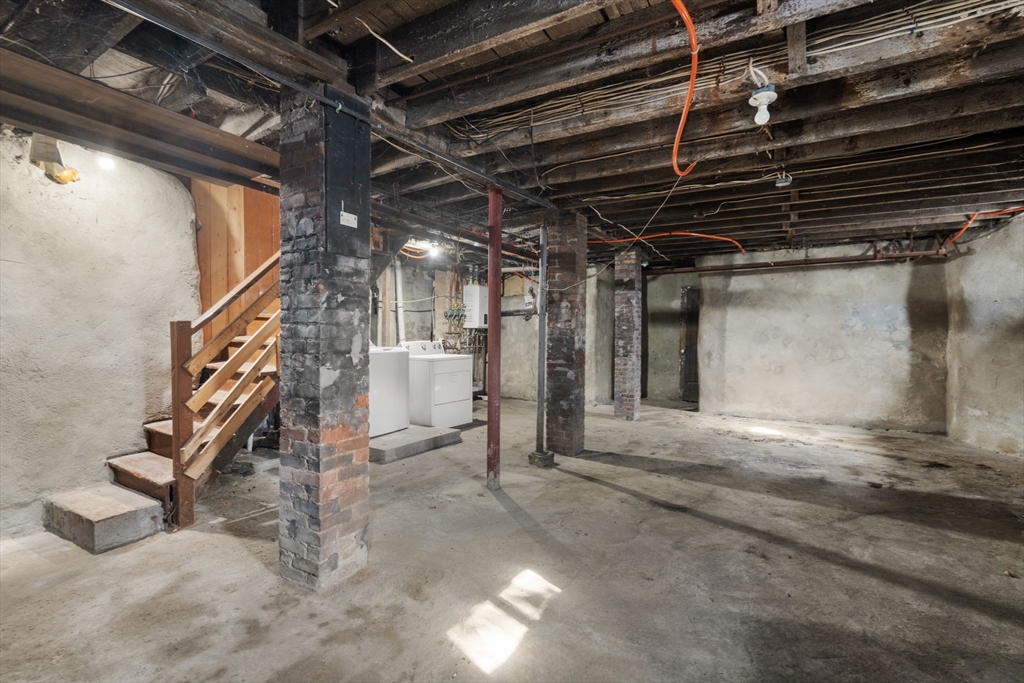 3 Atherton Street Boston, MA 02119 - Photo 29 of 29 a view of an empty room with stairs