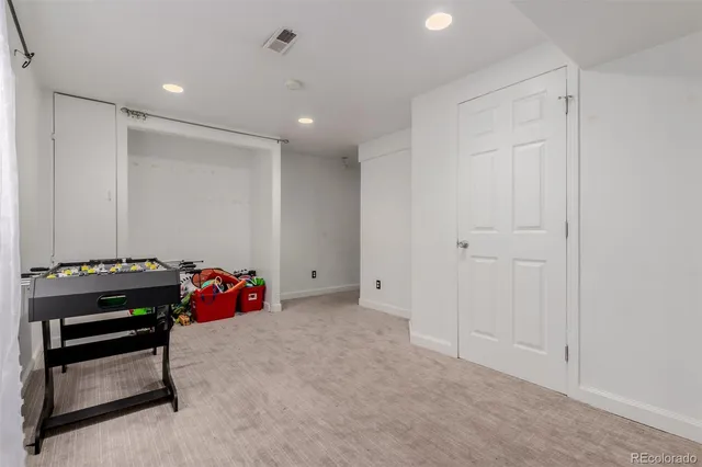 a room with furniture and musical instruments