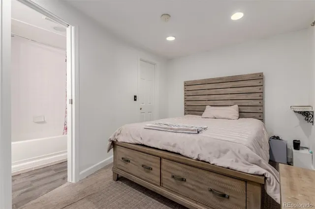 a bedroom with a bed and a cabinets