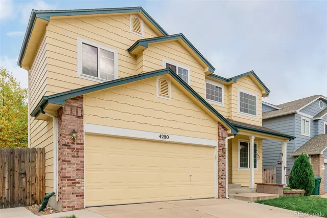 a view of a house with a small white door