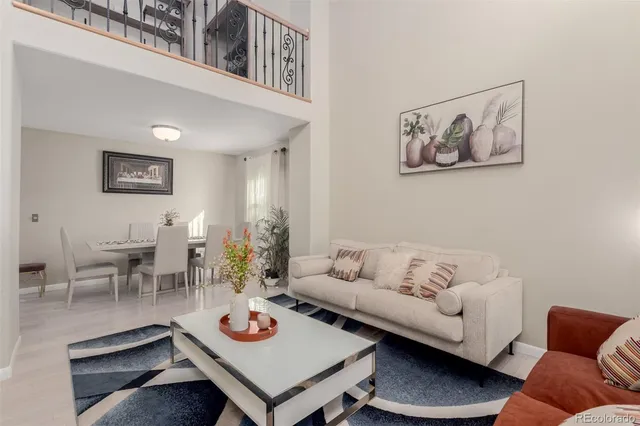 a living room with furniture and a table