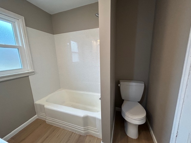 4715 50th Avenue Moline, IL 61265 - Photo 18 of 22 a white toilet sitting next to a bath tub