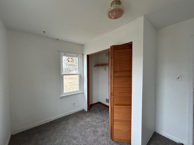 4715 50th Avenue Moline, IL 61265 - Photo 22 of 22 a view of an empty room with window and closet area