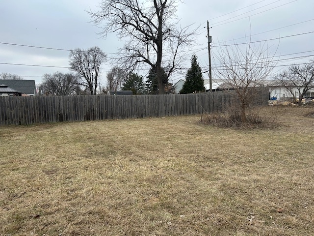 4715 50th Avenue Moline, IL 61265 - Photo 6 of 22 a view of backyard with wooden fence