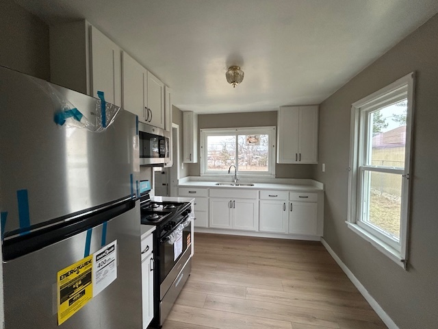 4715 50th Avenue Moline, IL 61265 - Photo 7 of 22 a kitchen with a refrigerator and a stove