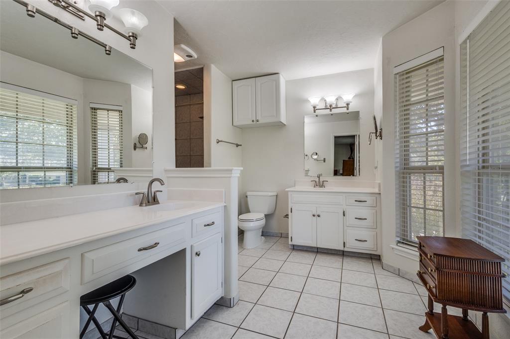 10 Biltmore Court Trophy Club, TX 76262 - Photo 18 of 25 a spacious bathroom with a double vanity sink a mirror and a bathtub
