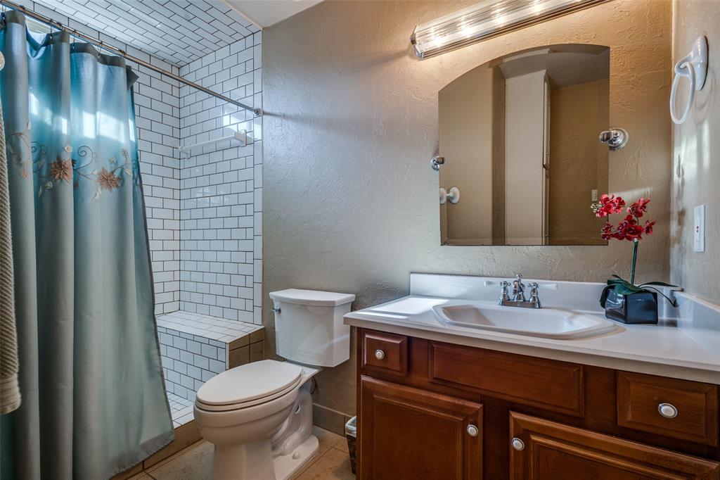 10 Biltmore Court Trophy Club, TX 76262 - Photo 23 of 25 a bathroom with a sink and a mirror