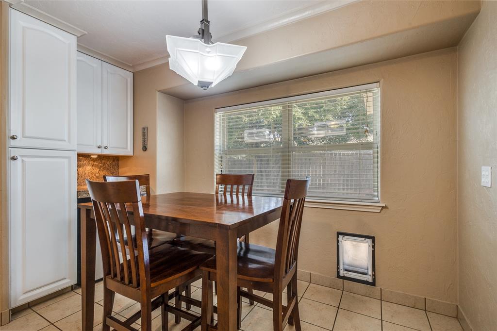 10 Biltmore Court Trophy Club, TX 76262 - Photo 10 of 25 a view of a dining room with furniture and a window