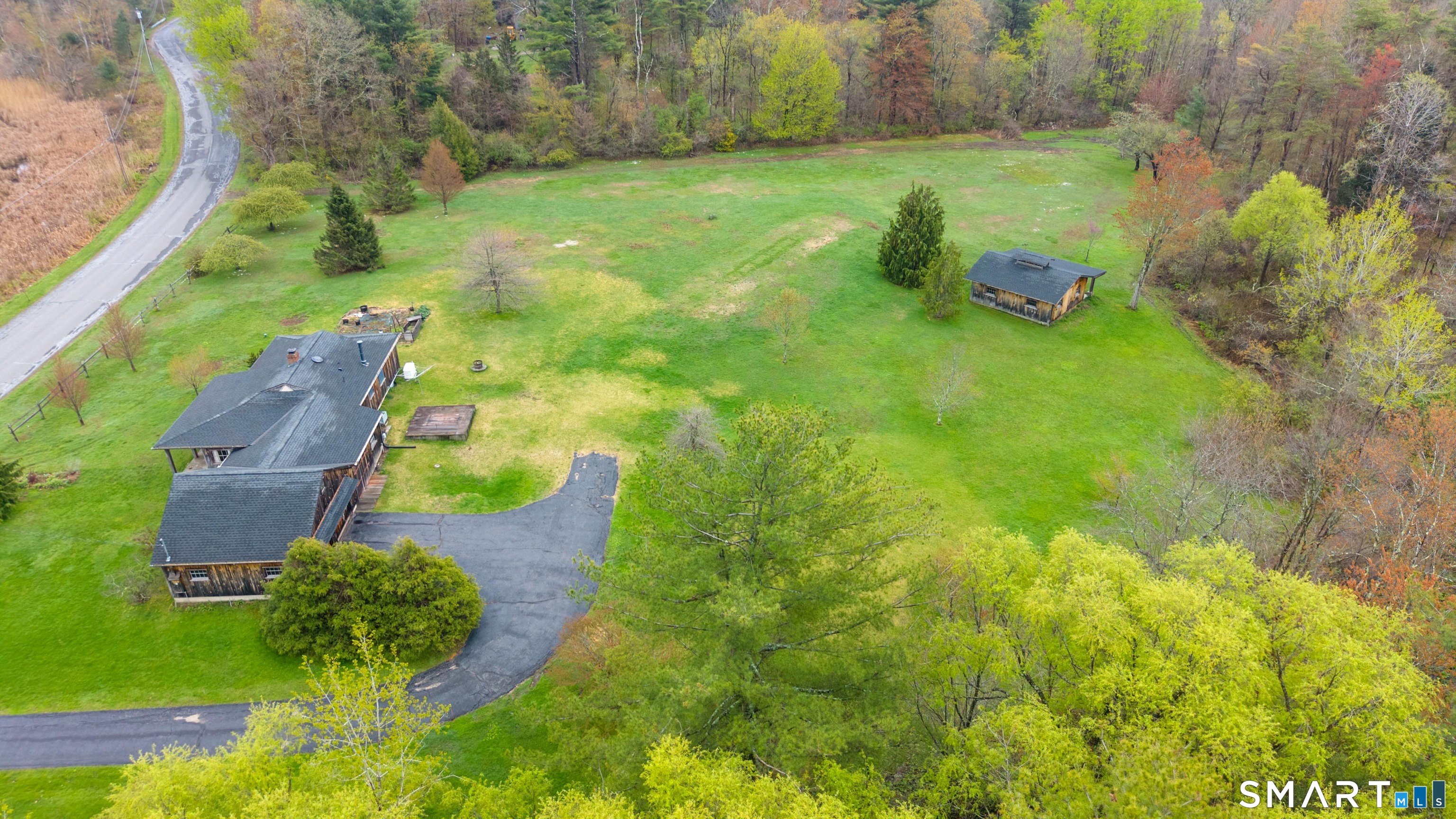 139 West Side Road Goshen, CT 06756 - Photo 3 of 17 a backyard of a house with lots of green space