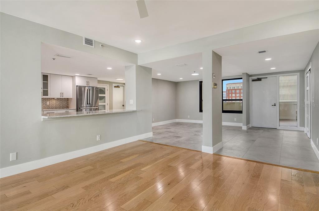 1255 North Gulfstream Avenue, Unit 702 Sarasota, FL 34236 - Photo 15 of 53 a view of a kitchen with a refrigerator and a stove top oven