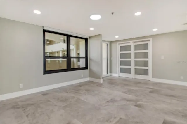 a view of an empty room with a window