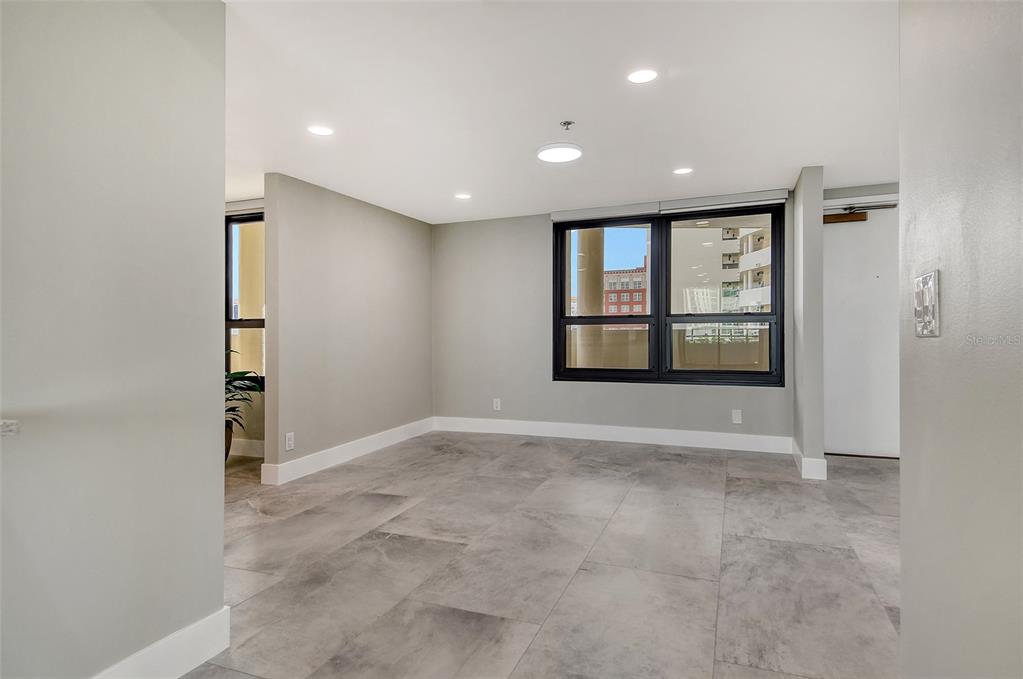 1255 North Gulfstream Avenue, Unit 702 Sarasota, FL 34236 - Photo 19 of 53 an empty room with windows and closet